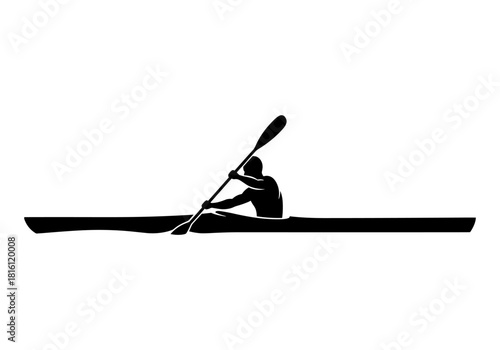 Silhouette of a kayaker paddling on a calm lake