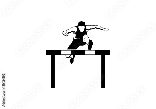 Silhouette of male athlete jumping over hurdle