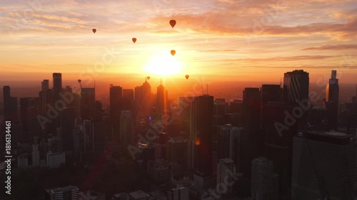 Sunrise Drone Footage of Melbourne Skyline with Hot Air Balloons