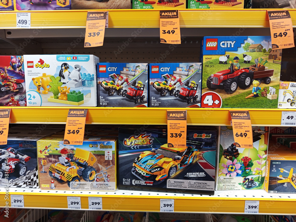 Naklejka premium Zvyagel, Ukraine - November 20, 2025: Colorful display of LEGO building sets on store shelf, featuring various themes and prices, showcasing creativity and playfulness in children's toys