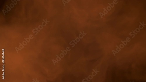 Mystical reddish-brown fog or steam rising against a dark backdrop, an ethereal and moody abstract background concept