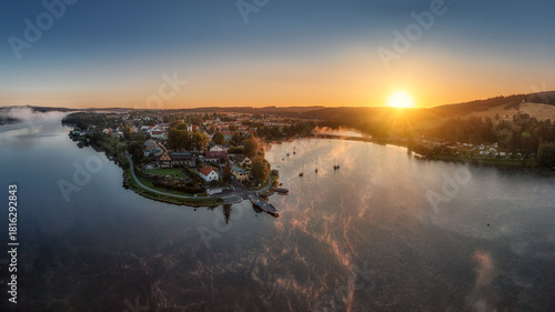 Frymburk on the shore of the Lipno dam at sunset from above