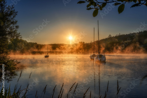 Frymburk on the shore of the Lipno dam at sunrise with fog