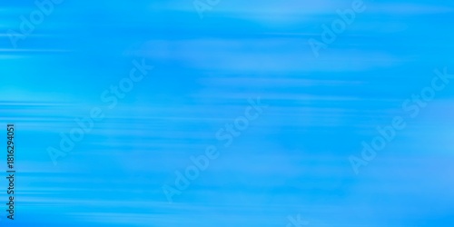 Blue abstract background with soft horizontal motion lines. Abstract background of bright blue. Gradient, fast brush, modern, elegant, vibrant style for display, web, print. Speed blue texture backdro