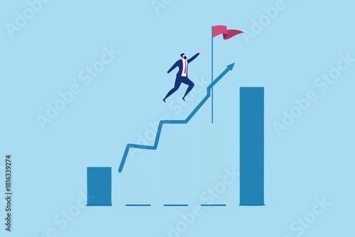 Businessman reaching goal on growing chart achieving success