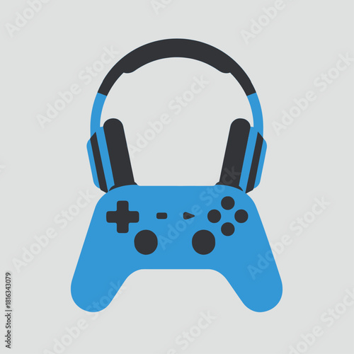 A blue video game controller with black and blue headphones resting on top of it, set against a plain gray background.
