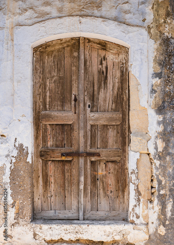 old entrance door seen from the outside of the building