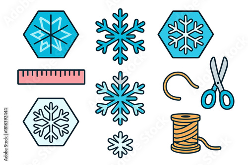 Assortment of winter snowflake symbols and essential crafting tools including scissors, ruler, and thread spool