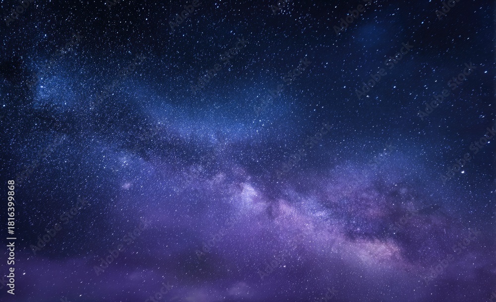 Fototapeta premium Celestial expanse of stars and nebulous cosmic dust in blues, purples, and deep blacks