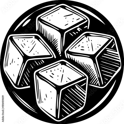 Four tofu cubes arranged in a circle on a plate
