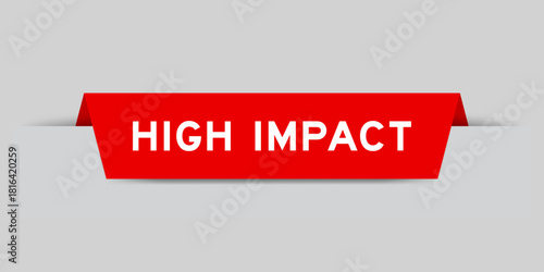 Red color inserted label with word high impact on gray background