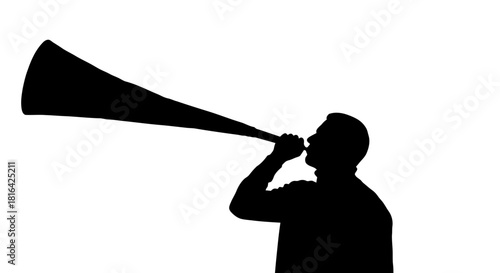 Silhouette of a person blowing a vuvuzela horn