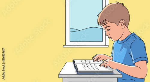 Boy reading a braille book with his fingers, sitting at a table near a window.