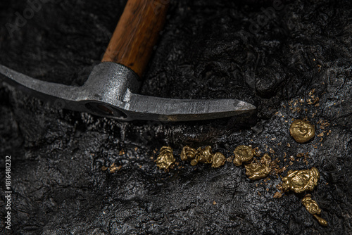 A gold vein, small pieces of gold nuggets within a rock, accumulation of gold in rocks, formed in cracks, faults, or fissures. Close up view