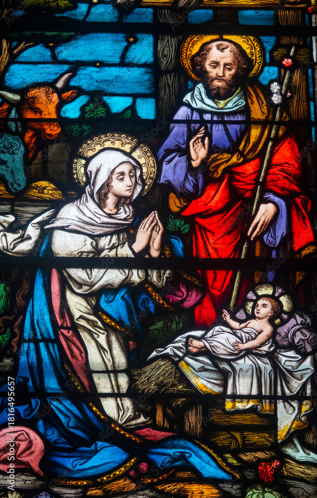 Fototapeta premium Stained glass (19th century) of Christmas Nativity Scene with Virgin Mary, Saint Joseph, and Jesus baby.