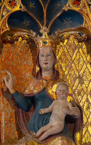 Statue (19th century) of Blessed Virgin Mary holding baby Jesus Christ in her arms.
