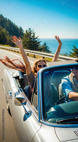 Carefree couple driving a vintage convertible with arms raised along the scenic Pacific Coast Highway, embodying the spirit of adventure and freedom. Concept for Love and Valentines Day