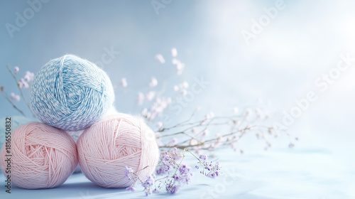 colorful ball of yarn surround flowers at serene background