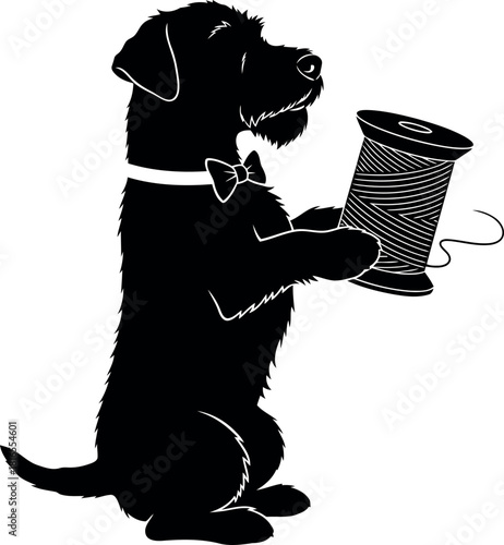 Black dog in bow tie holds spool of thread
