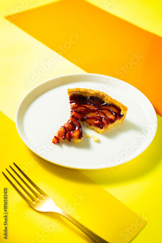 fresh baked cuttedplum pie with crust pastry