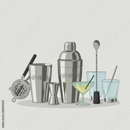 A collection of essential silver bar tools and cocktail glasses for mixing drinks.