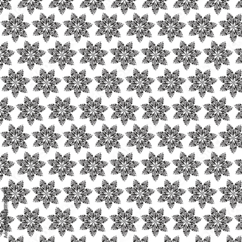 Intricate black and white snowflake pattern with repeating hexagonal designs creating a detailed wintery texture