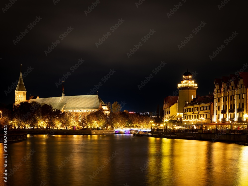 Fototapeta premium The Kaliningrad embankment at night with illumination and bridge