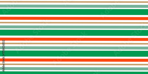 Seamless pattern of Christmas candy canes. Christmas candy cane background with red and green stripes. Christmas wrapping paper.