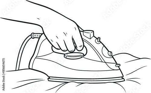 Hand holding an electric iron pressing wrinkled fabric on an ironing board