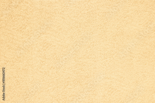 Beige pastel on plaster surface. Colored background