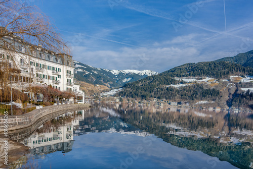 Winter landscape of lake Zell in Zell am See over Austrian Alps.