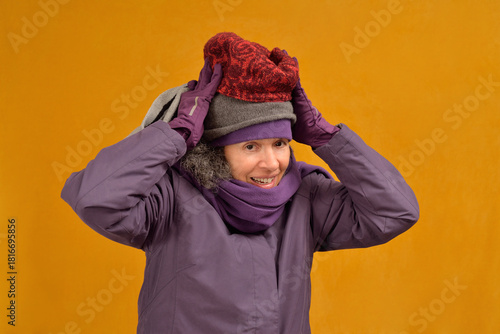 Woman wearing three wool hats