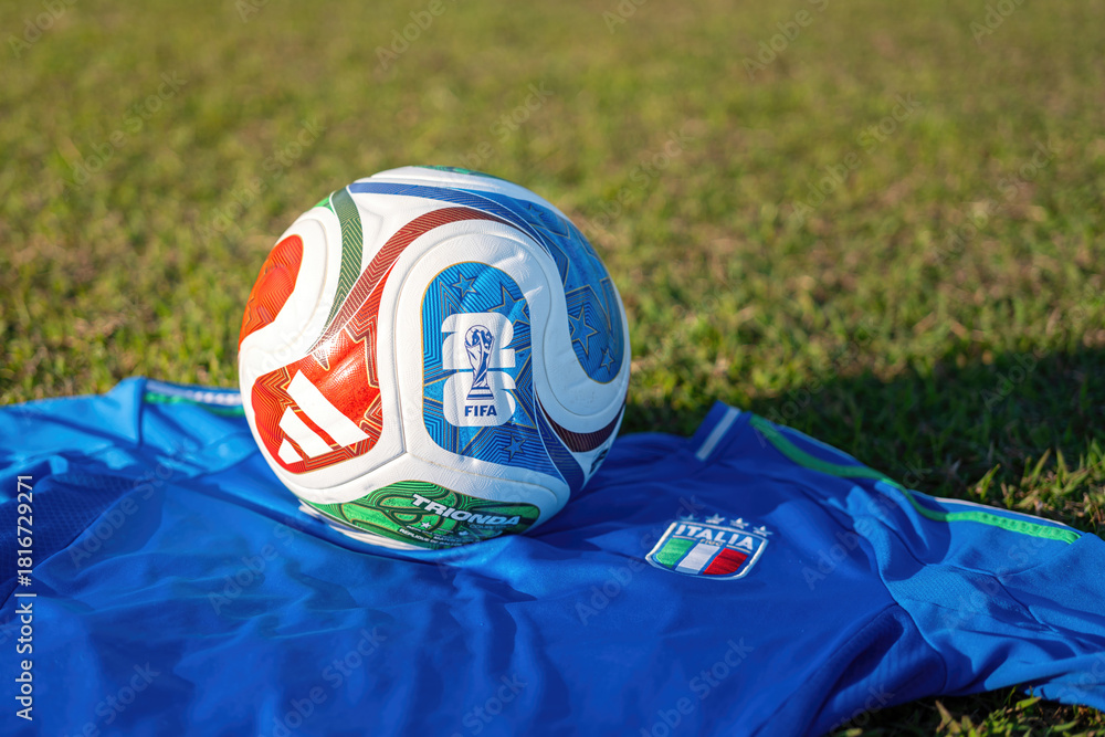 Fototapeta premium Bangkok, Thailand - 23 November 2025; Italy football jersey is placed on football training field with the 
