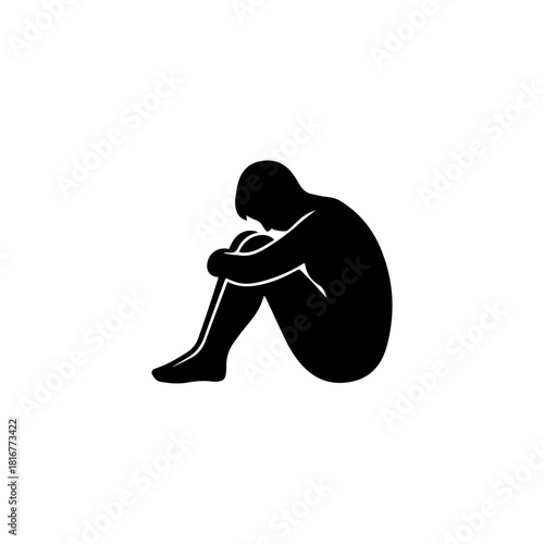 Black silhouette of a lonely person sitting and hugging their knees. Expresses sadness, loneliness, and distress. Ideal for mental health and emotional themes
