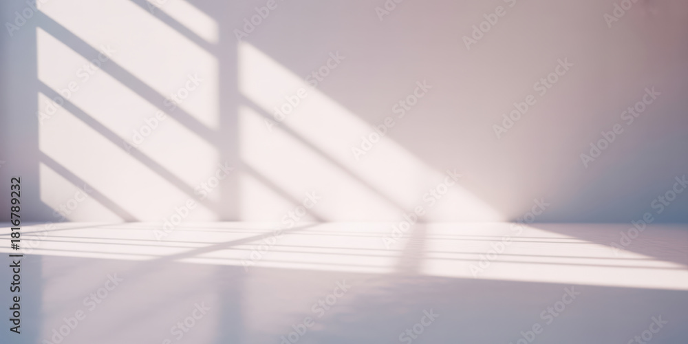 Obraz premium Minimalist background with soft diffused natural light casting geometric shadows on white wall