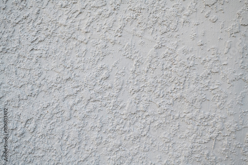 White stucco wall texture background on South Florida home outside. white stucco wall texture on house exterior, outside of home stucco texture background