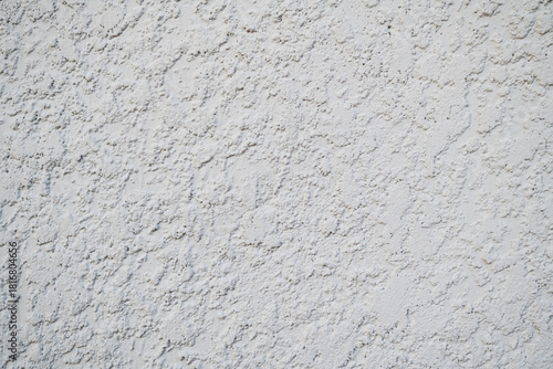 White stucco wall texture background on South Florida home outside. white stucco wall texture on house exterior, outside of home stucco texture background