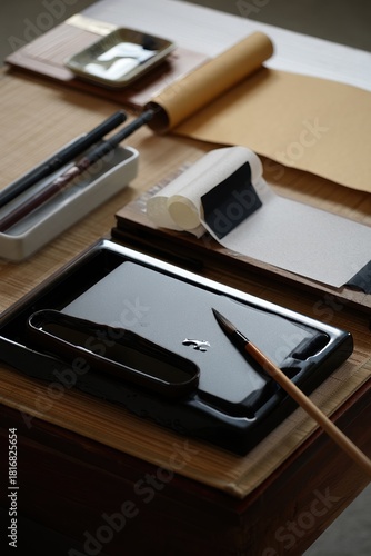 Wallpaper Mural Left corner desk with ink tray, brushes, and traditional calligraphy tools Torontodigital.ca
