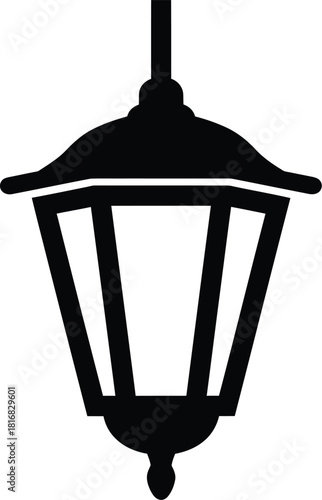 A simple black silhouette of a classic hanging lantern with a pointed finial at the bottom isolated on a white background representing illumination and vintage design