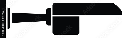 Simple black silhouette icon of a security camera mounted on a wall representing surveillance and safety systems in a minimalist graphic style