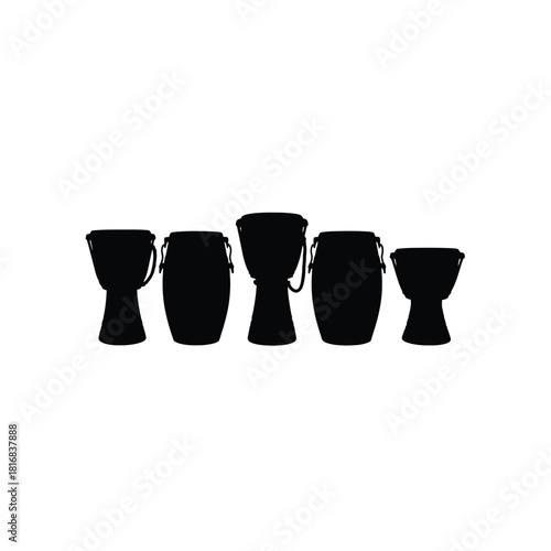 Five djembe drums in silhouette