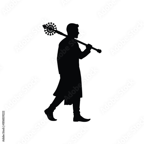 Man in robes carrying a staff silhouette