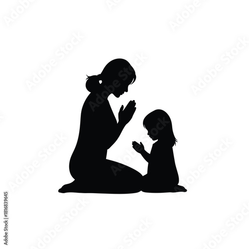 Mother and child praying together silhouette