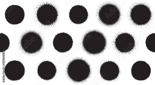 Black ink splatters with spiky edges on white background