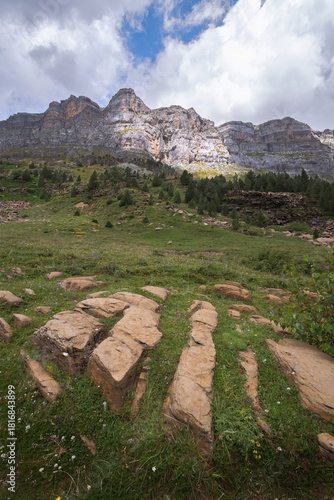 Majestic Mountain Landscape in the Pyrenees with Dramatic Rock Formations and Lush Green Meadows