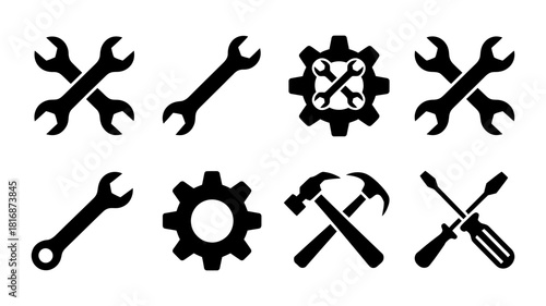 Versatile set of black silhouette tool icons including wrenches, gear, hammer, and screwdriver, symbolizing repair, maintenance, and industrial service.