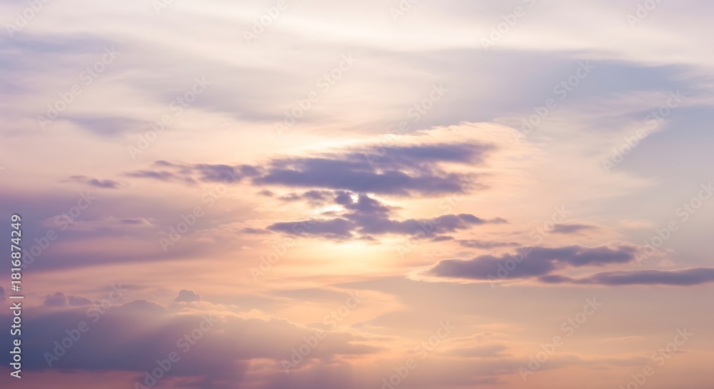 Fototapeta premium Pastel Sunset Sky Soft Clouds Warm Light Tranquil Atmosphere Serene Cloudscape Peaceful Nature Background Evening Sky Scenery Golden Hour Calm Weather
