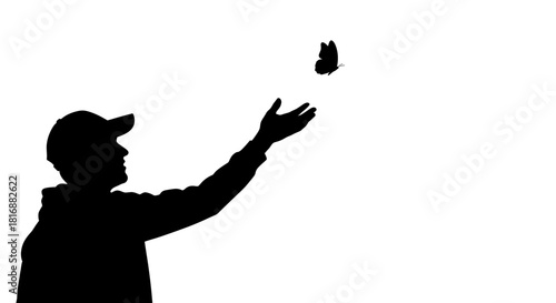 Young person in silhouette reaching out to a delicate butterfly in flight, symbolizing hope, freedom, and new beginnings against a clean white background.