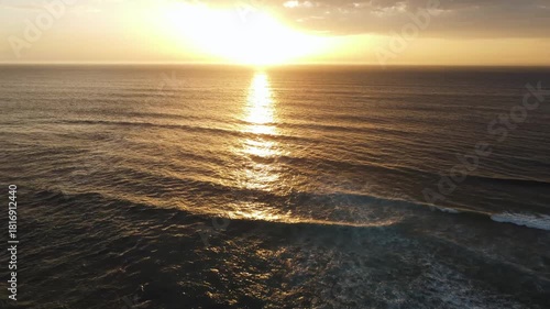 dusk ocean shimmer, cinematic footage depicting calm sea with radiant dusk hues and gentle ripples