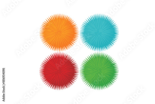 Four fluffy pom poms in bright colors arranged in a square